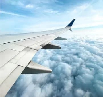 Airplane wing above the clouds